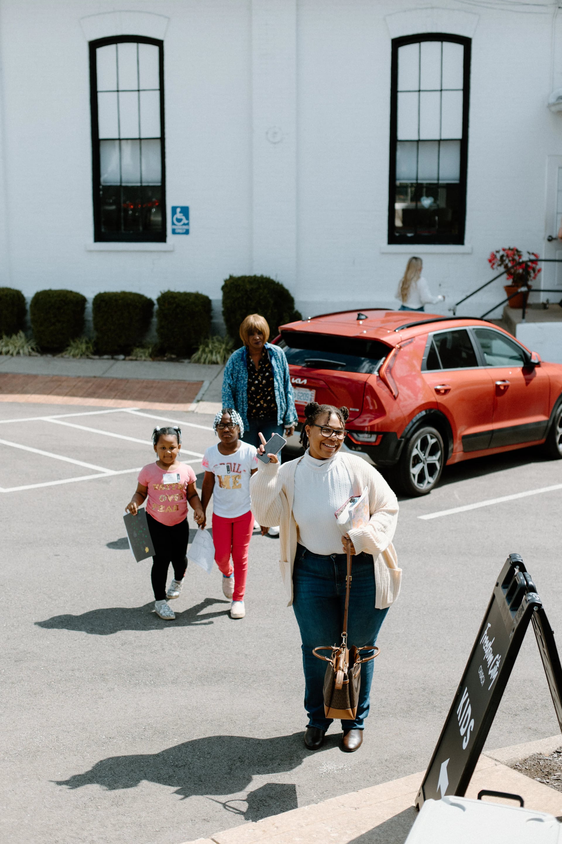 Families walking up to the church on Salem Road